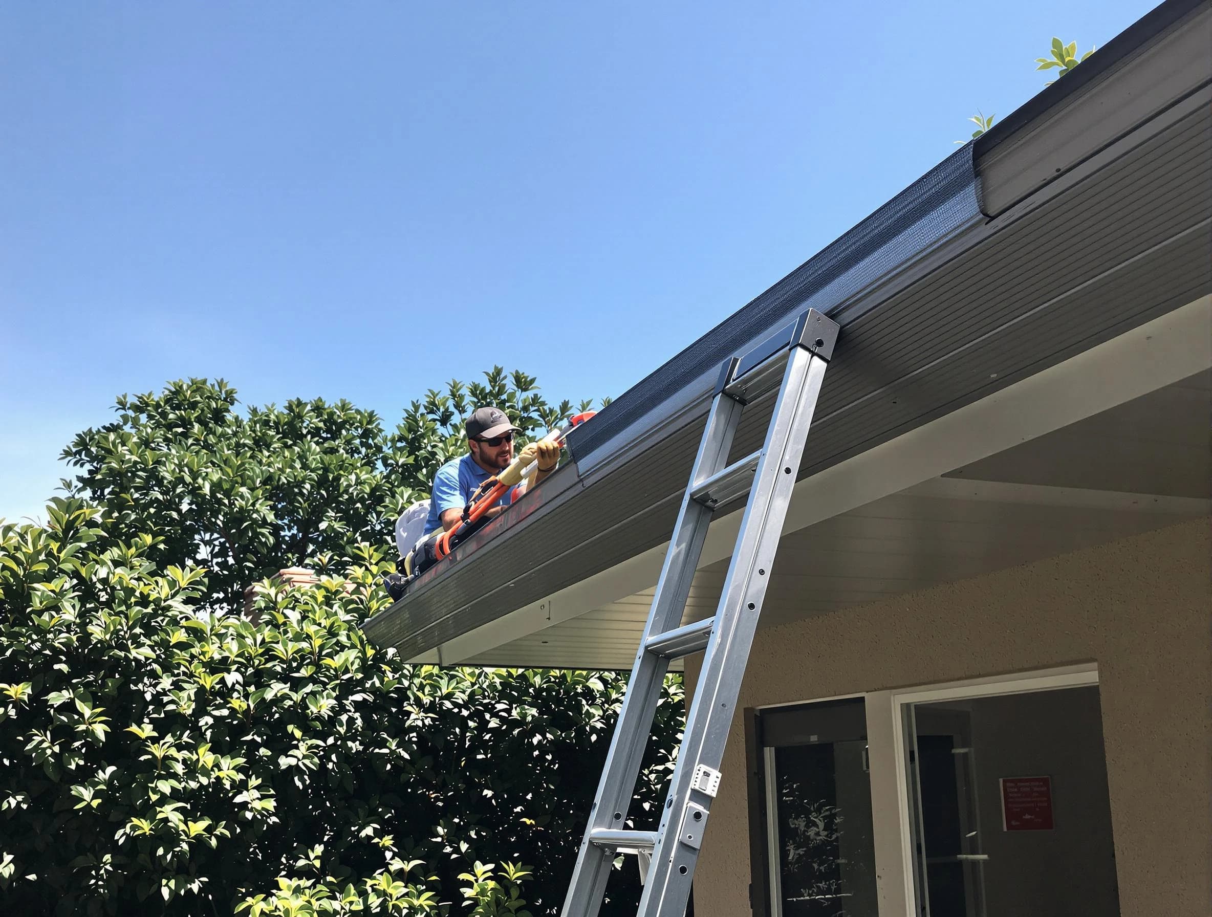 Willoughby Roofing Company installing gutter guards for a homeowner in Willoughby, OH